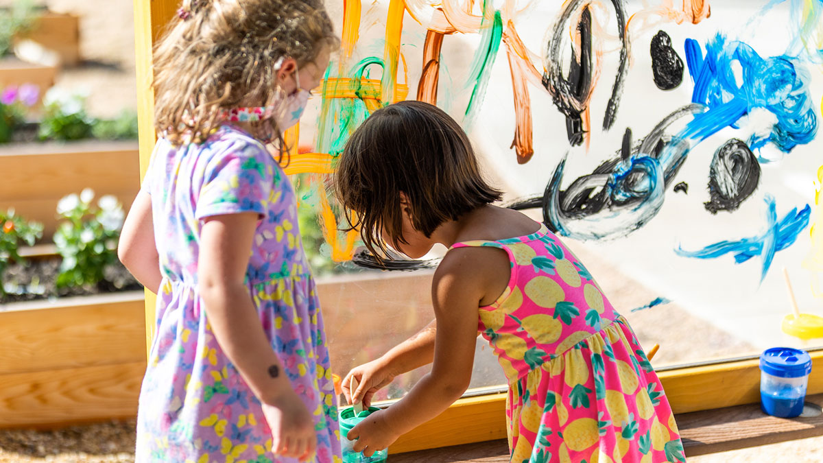 Two children painting